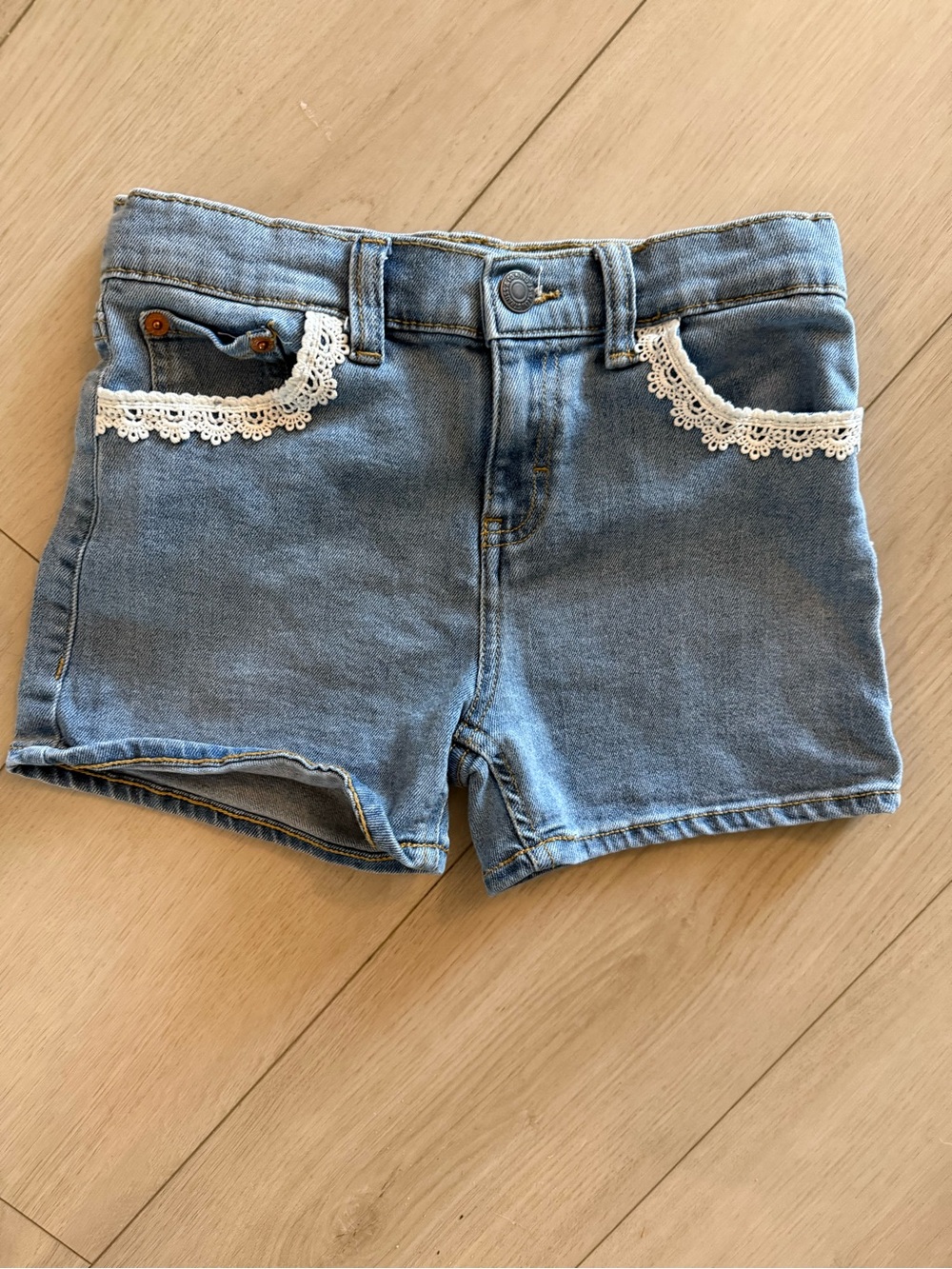 Girls size 10 Levi's light blue denim shorts with white lace trim